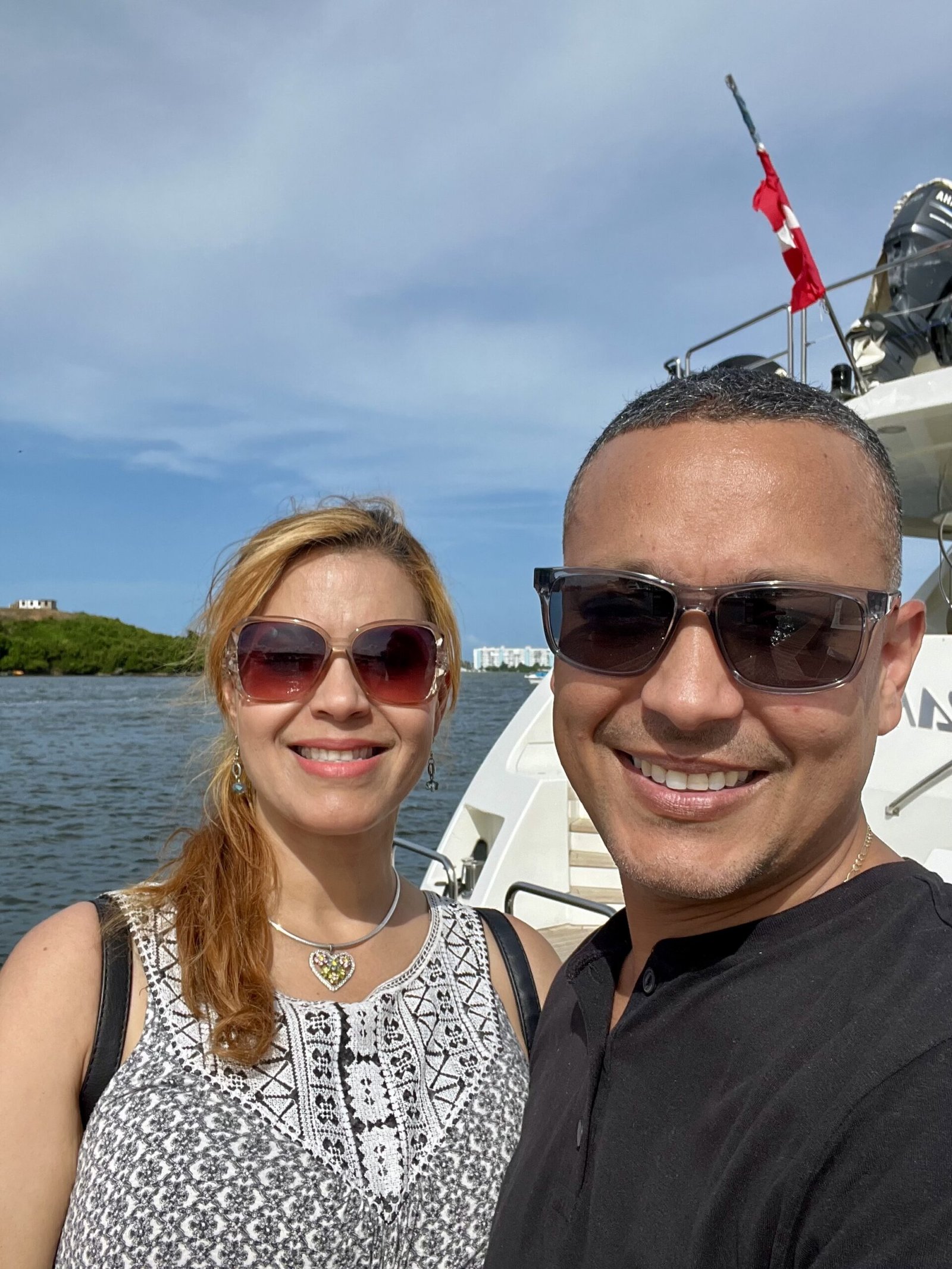 Rafael along his wife and a boat behind them